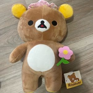 Rilakkuma plush with flower and pink hat